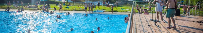 Outdoor swimming pool with people