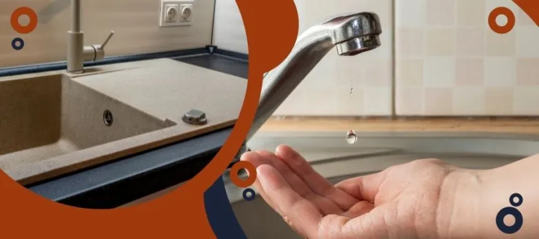 Water dripping from faucet into hand