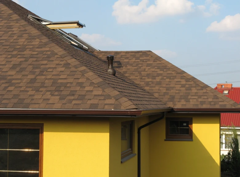 Asphalt shingle roof with skylights