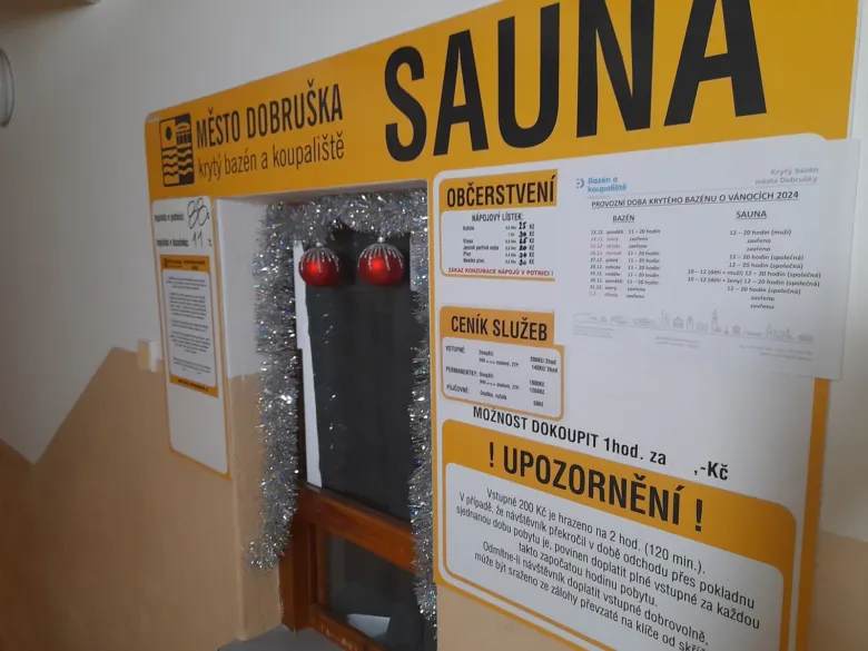 Sauna sign at pool entrance