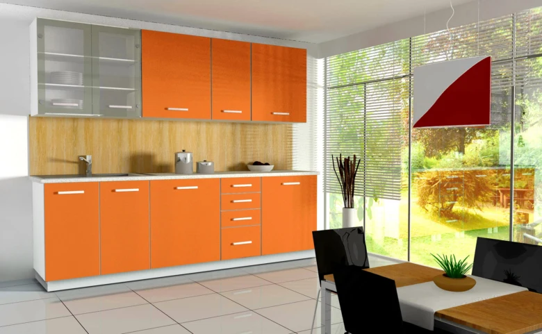 Moderní kuchyňská linka s oranžovými skříněmi pro článek o rozměrech.