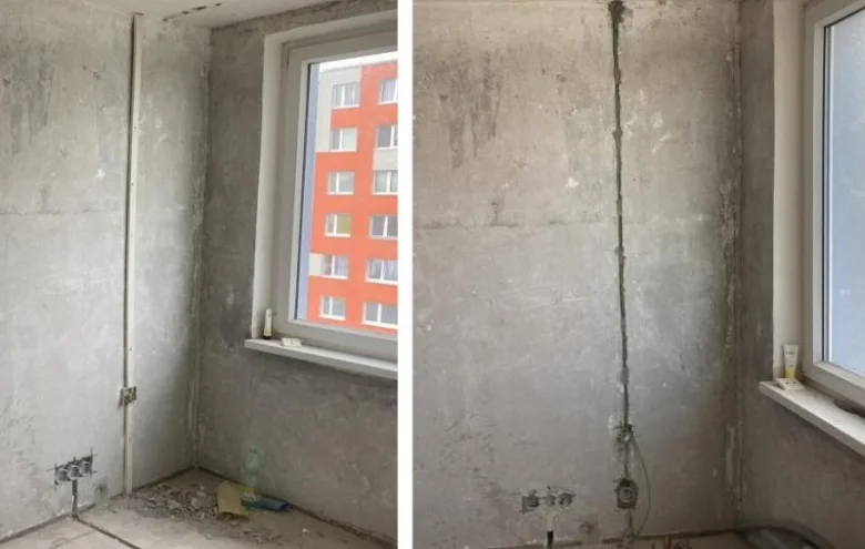 Neúplná rekonstrukce bytu s viditelnou elektroinstalací a vývody na zdi.