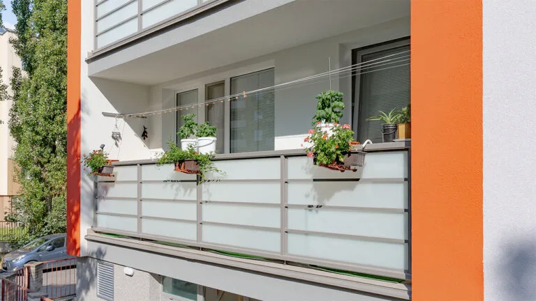 Modern balcony with plants and railings
